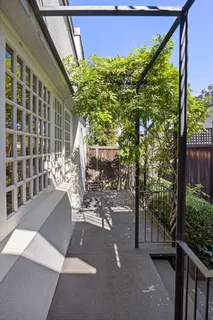 a view of a back yard from a balcony