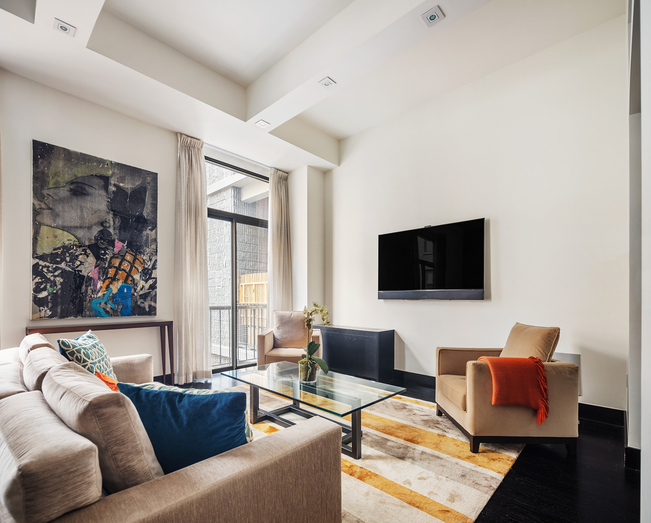 Park Ave S, Unit 7PR Manhattan, NY 10010 - Photo 3 of 15 a living room with furniture and a flat screen tv