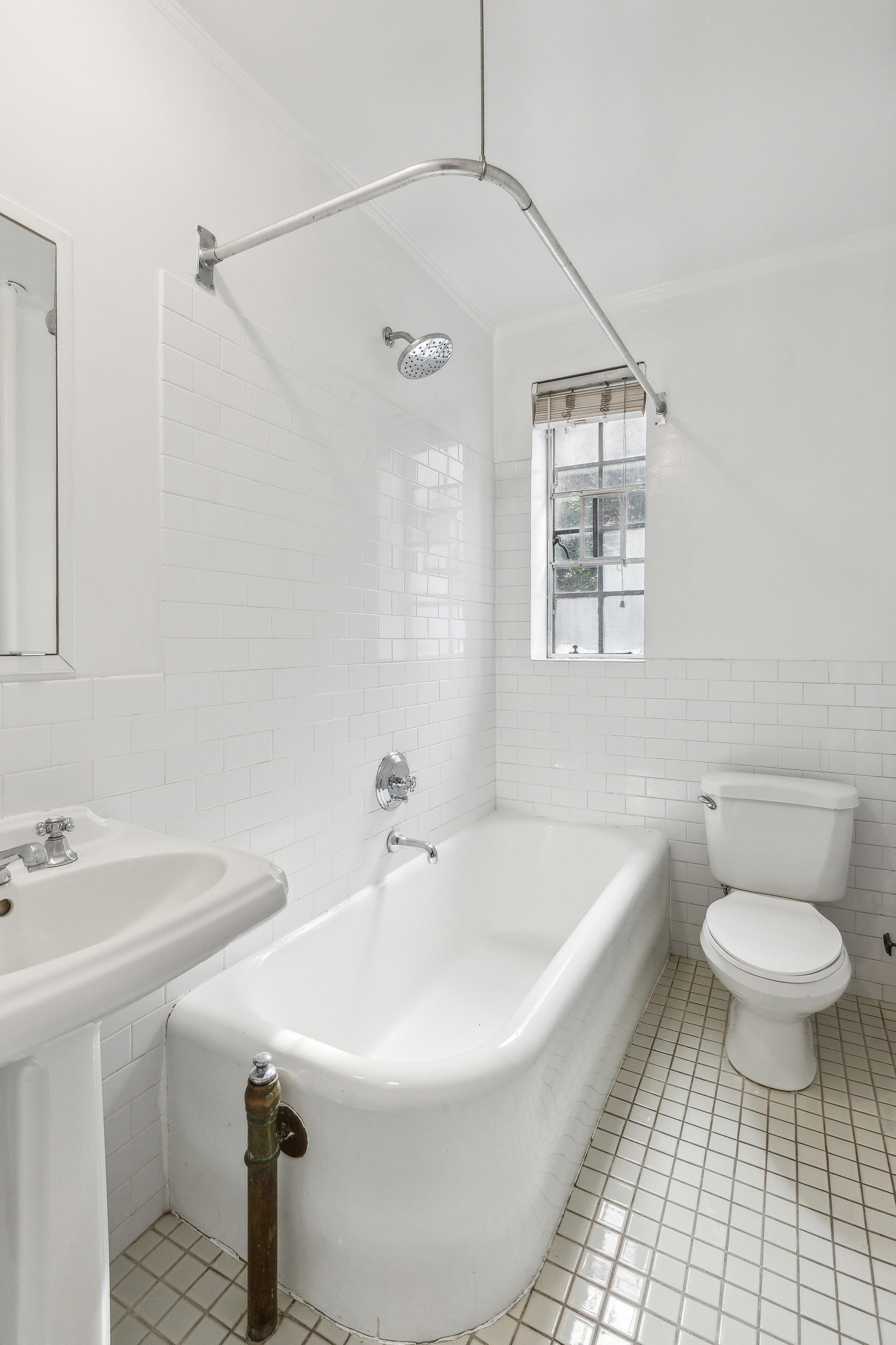 116 Pinehurst Avenue, Unit H32 Manhattan, NY 10033 - Photo 13 of 21 a bathroom with a sink toilet and shower