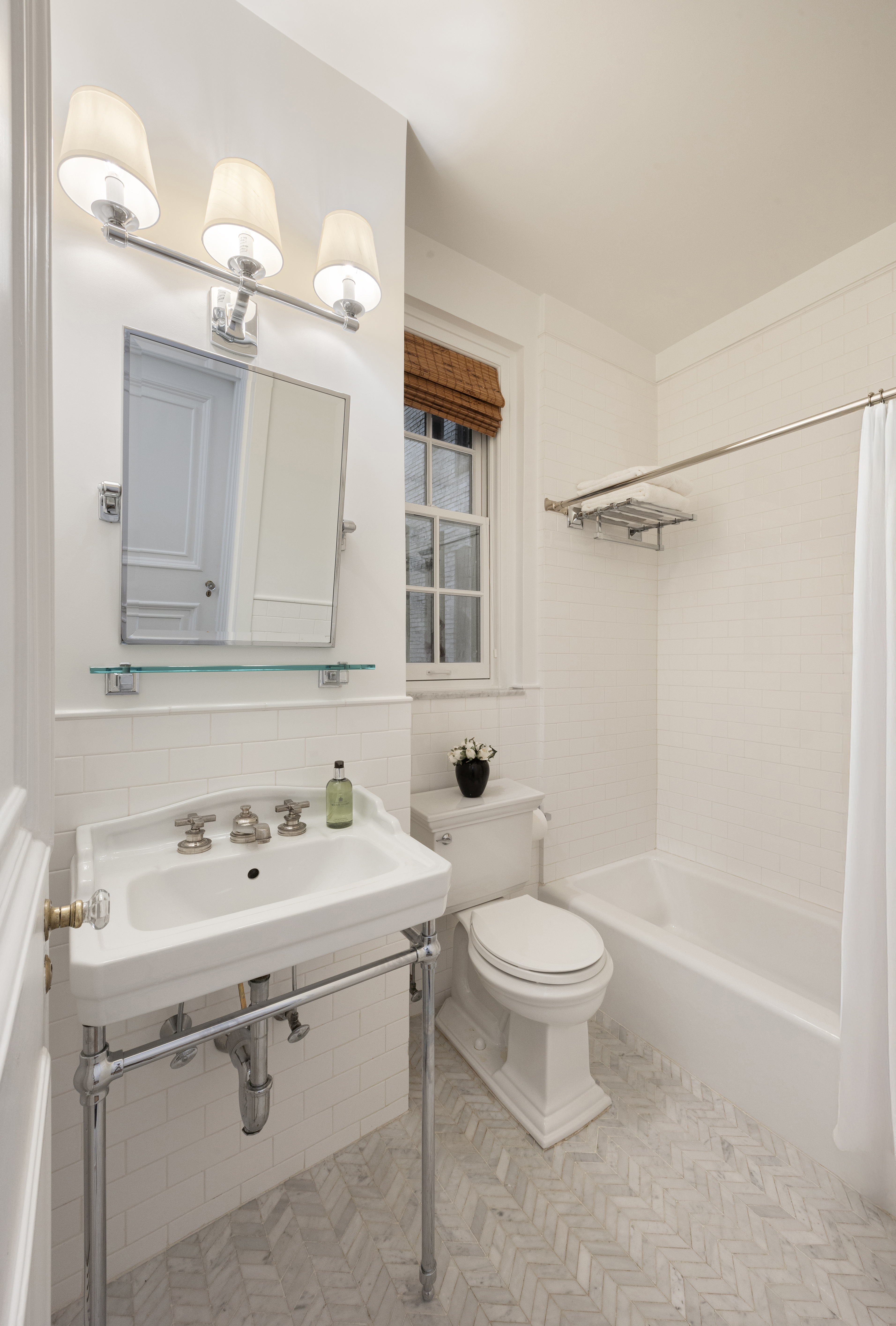 164 East 72nd Street, Unit 3B Manhattan, NY 10021 - Photo 8 of 11 a bathroom with a sink a toilet and shower