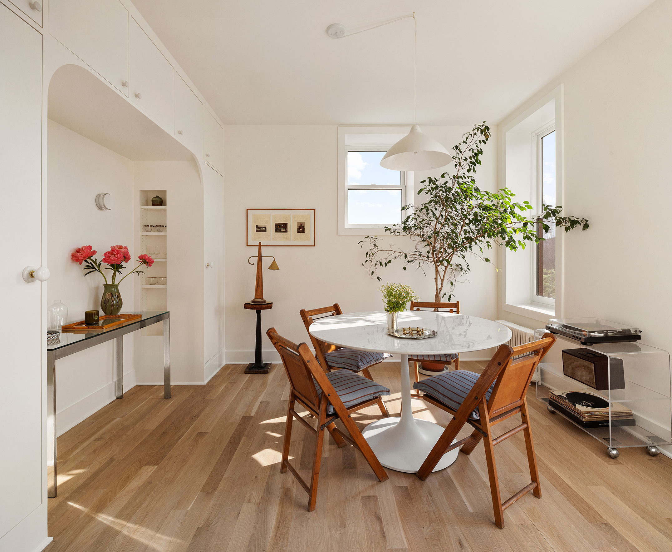 99 Avenue B, Unit PHDE Manhattan, NY 10009 - Photo 8 of 18 a view of a dining room with furniture and chandelier