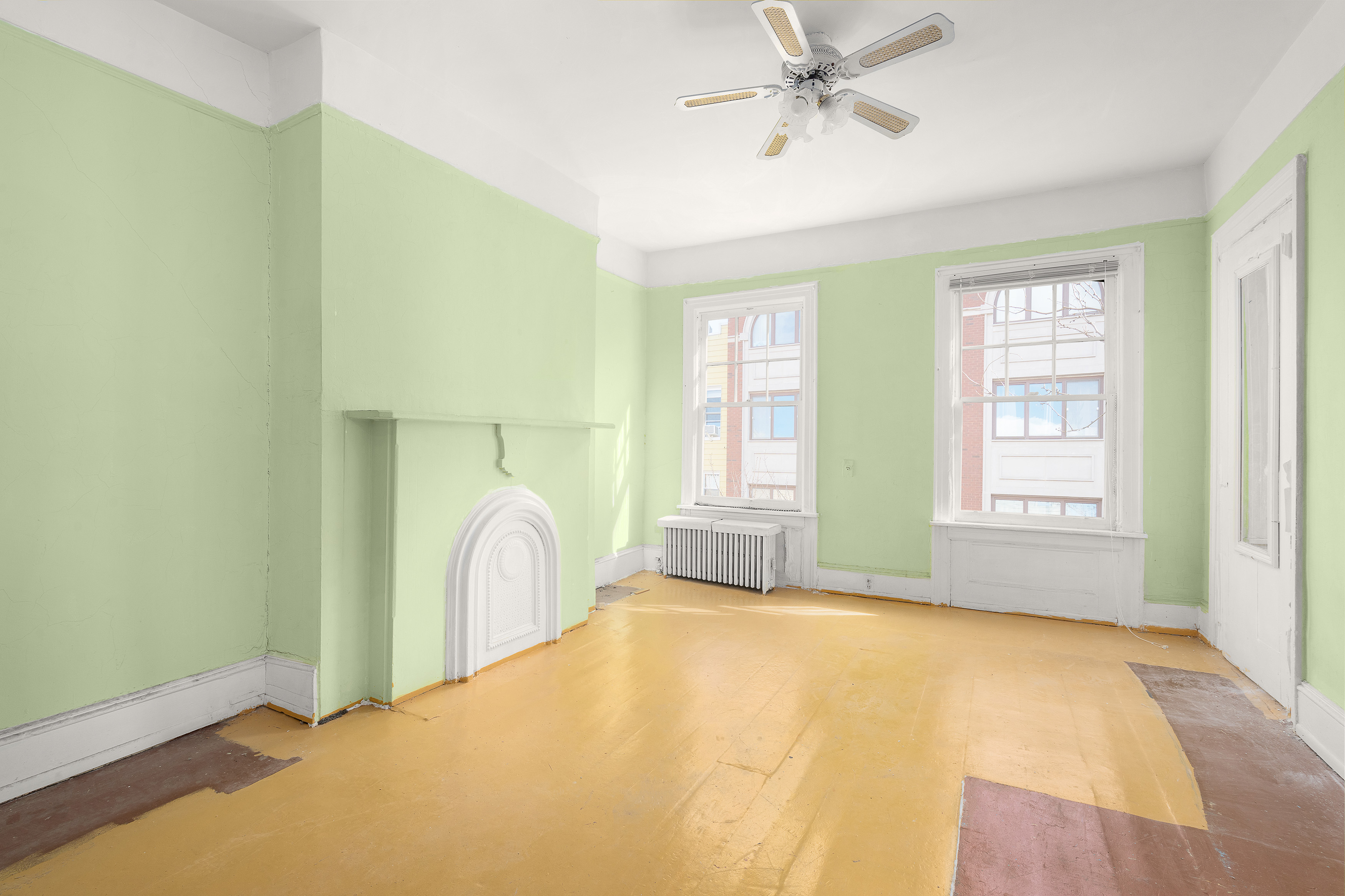 147 Eckford Street Brooklyn, NY 11222 - Photo 3 of 9 a view of a room with window and a ceiling fan