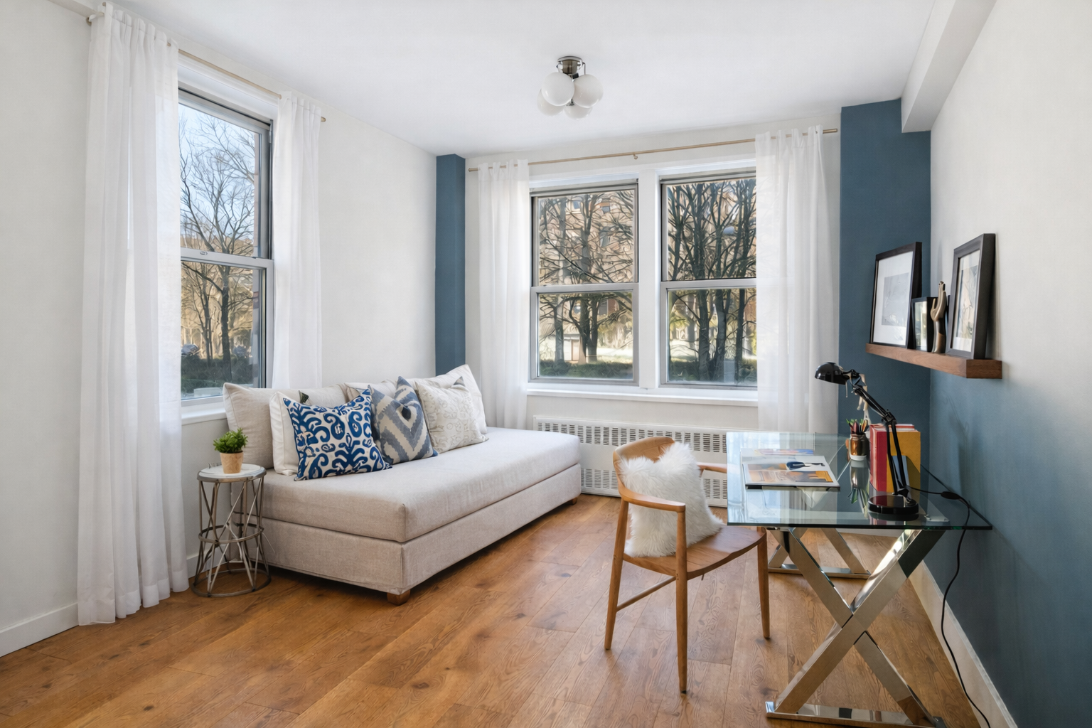 3755 Henry Hudson Parkway West, Unit 3F Bronx, NY 10463 - Photo 11 of 17 a living room with furniture and a window