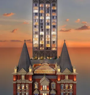 a view of a large building with a clock on the wall