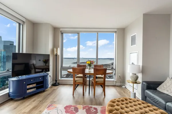 a view of a dining room with furniture and window