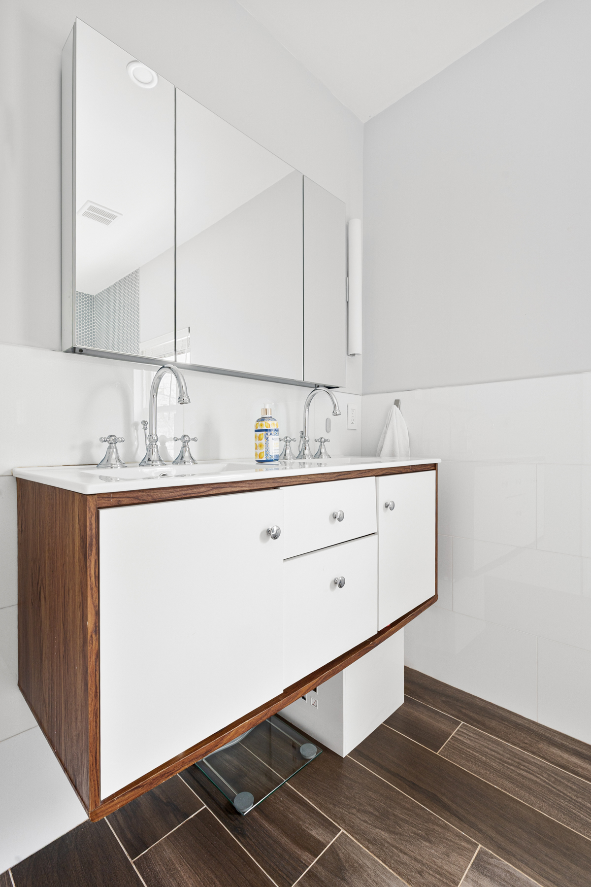 202 22nd Street Brooklyn, NY 11232 - Photo 17 of 28 a bathroom with a sink and a mirror