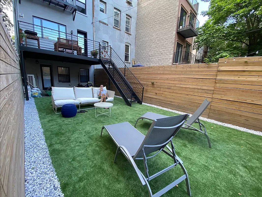 894 Greene Avenue Brooklyn, NY 11221 - Photo 11 of 11 a view of a chairs and table in the backyard