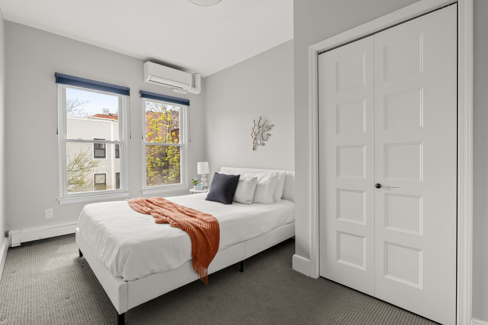 88 Hancock Street, Unit 17 Cambridge, MA 02139 - Photo 10 of 18 a bedroom with a bed and a window