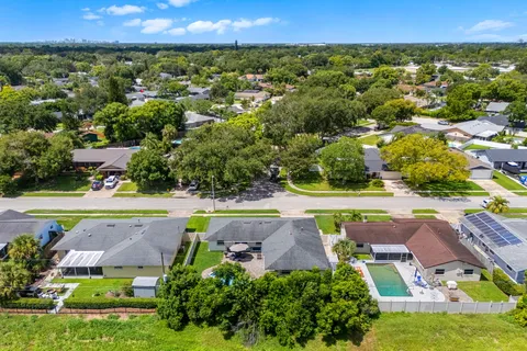 an aerial view of a house with a swimming pool