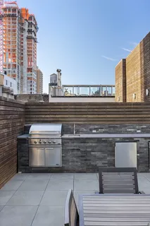 a view of a building and trees in the background