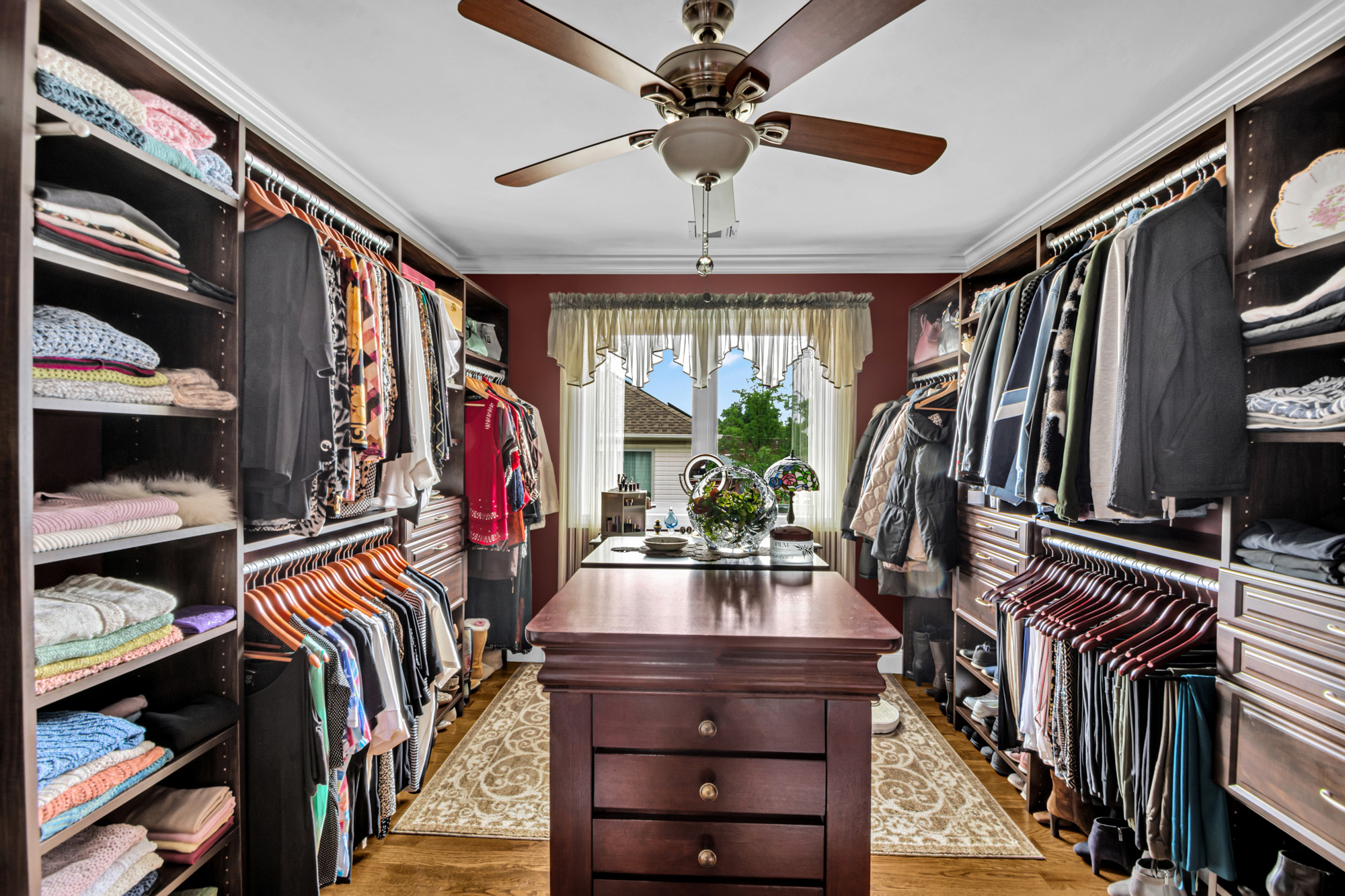 909 Jewett Avenue Staten Island, NY 10314 - Photo 19 of 65 a view of walk in closet with clothes and shoes
