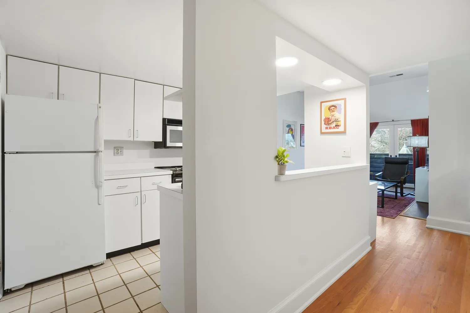 a white refrigerator freezer sitting inside of a kitchen