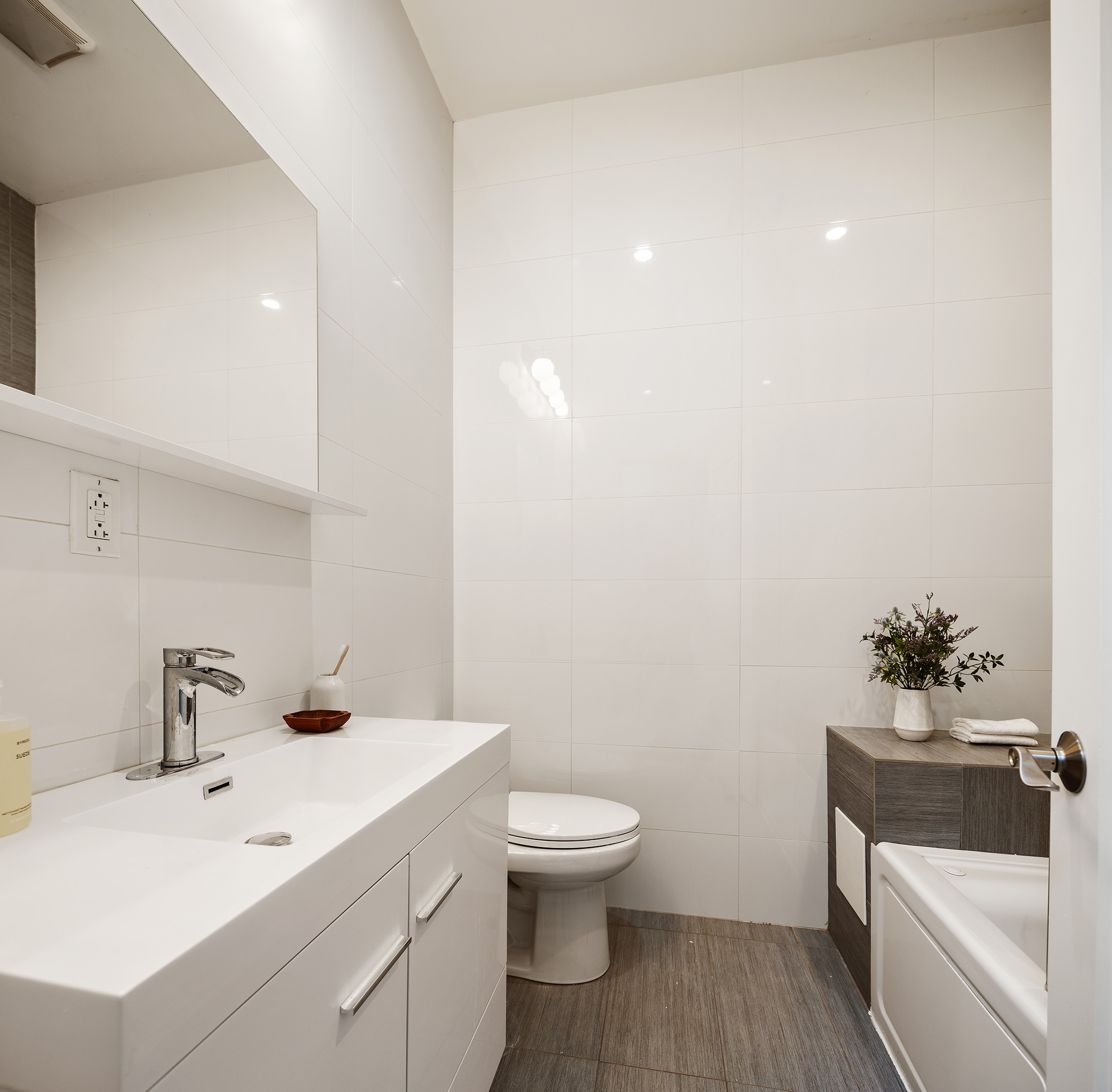34 Woodbine Street Brooklyn, NY 11221 - Photo 12 of 15 a bathroom with a sink a toilet and a mirror