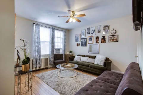 a living room with furniture and a window