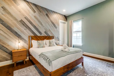 a bedroom with a bed and window