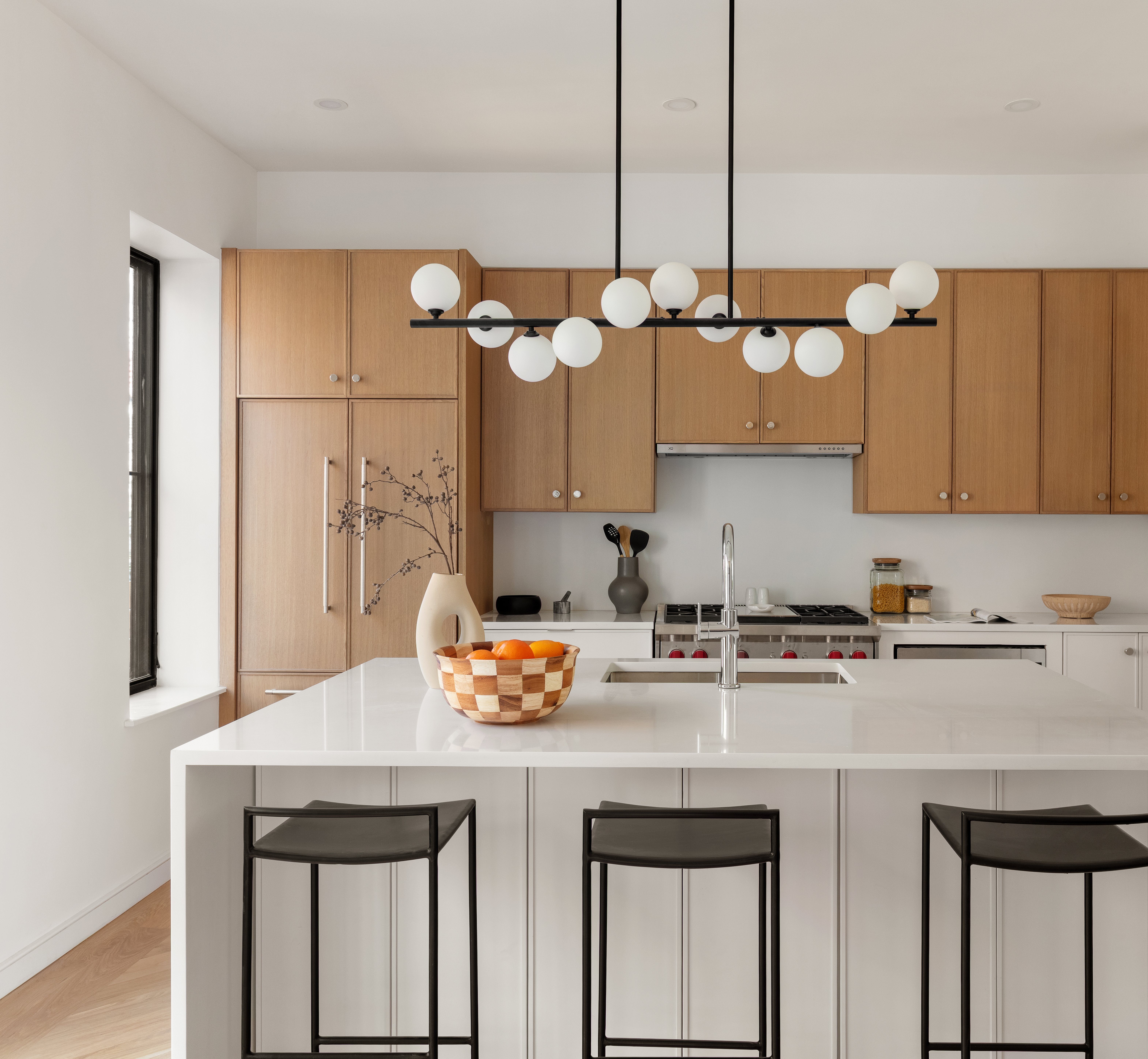 357 Eastern Parkway Brooklyn, NY 11216 - Photo 5 of 15 a kitchen with a sink a stove and chairs