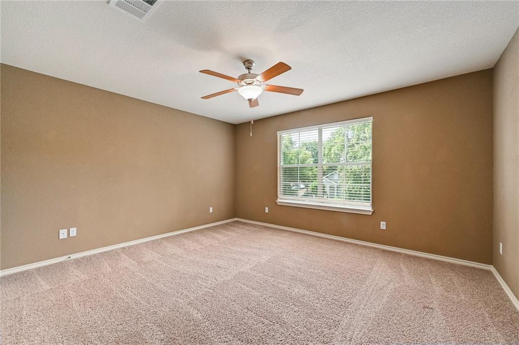 1102 Clermont Avenue Austin, TX 78702 - Photo 24 of 30 a view of room with a ceiling fan and window
