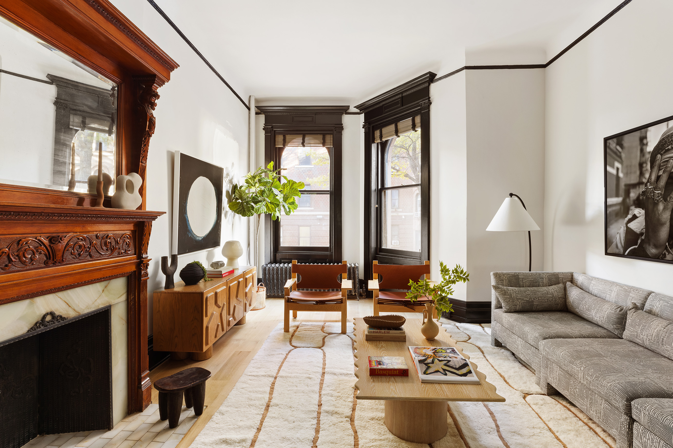 614 West 146th Street, Unit 4FAM Manhattan, NY 10031 - Photo 2 of 18 a living room with furniture fireplace and large windows