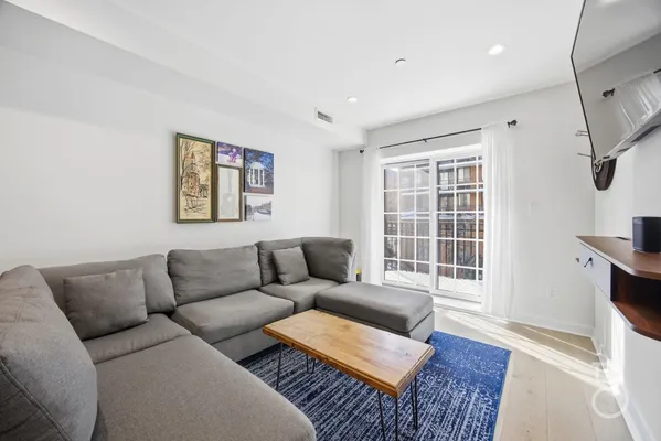 a living room with furniture and a window