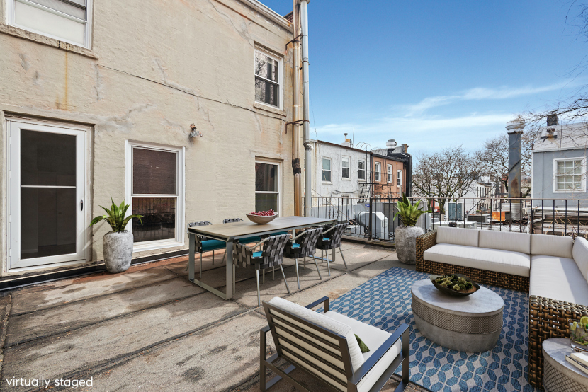 120 Smith Street, Unit 1 Brooklyn, NY 11201 - Photo 10 of 11 a view of a patio with couches and a potted plant on a table