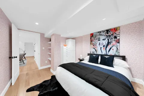 a bedroom with a bed and a view of bathroom