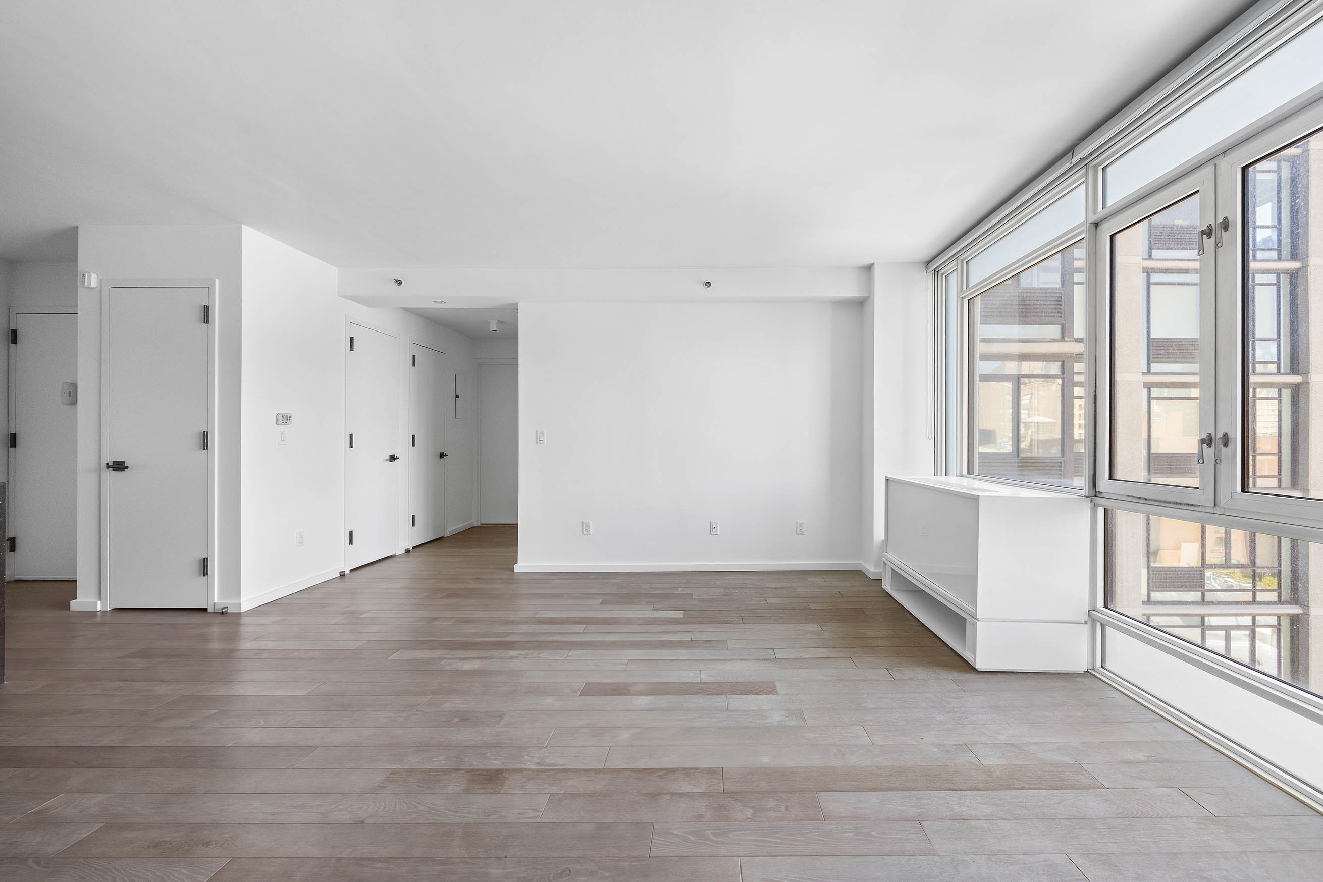 385 1st Avenue, Unit 10A Manhattan, NY 10010 - Photo 3 of 9 a view of an empty room with a window