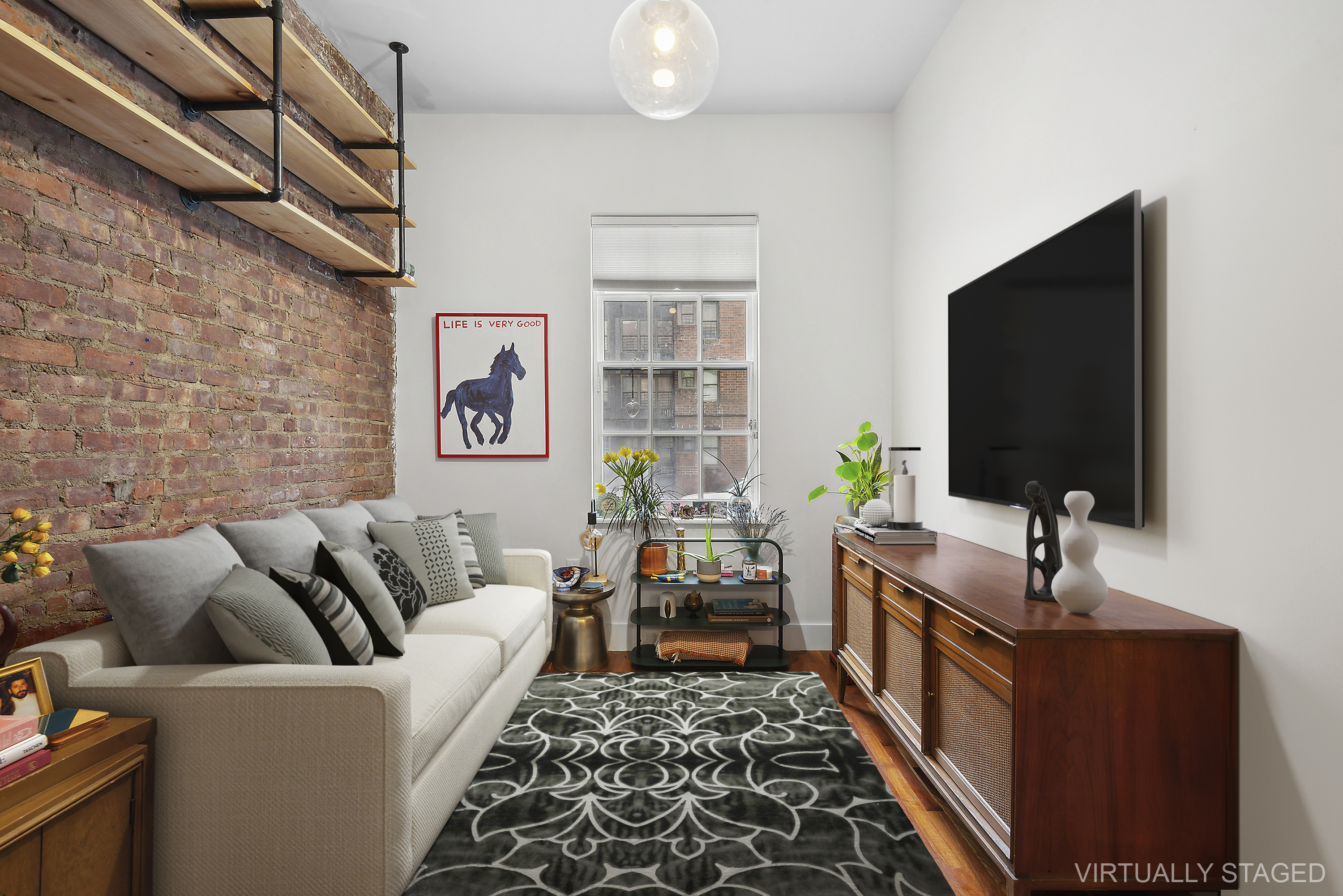 180 Bainbridge Street, Unit 112 Brooklyn, NY 11233 - Photo 2 of 30 a living room with furniture and a flat screen tv