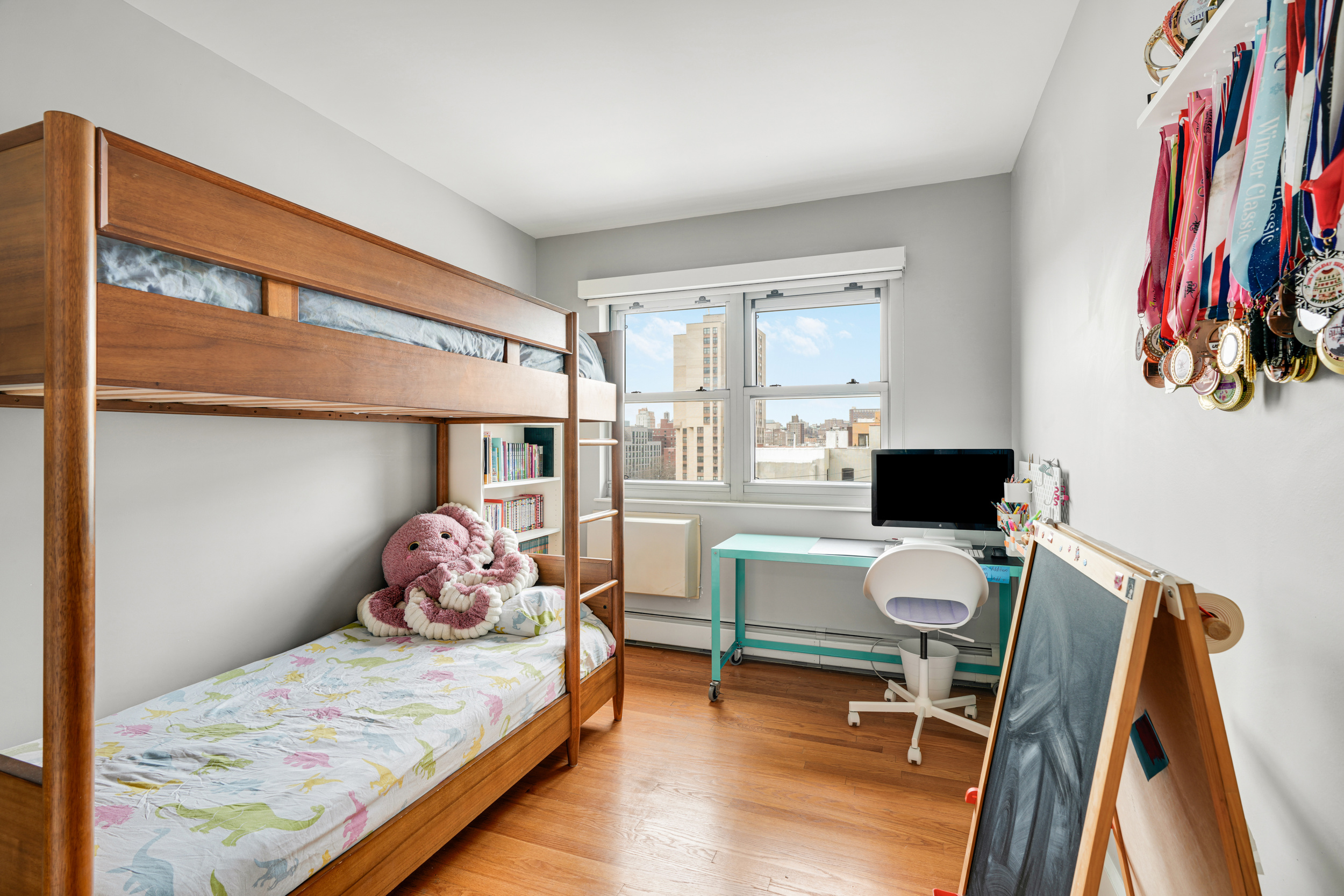 1820 Madison Avenue, Unit 7C Manhattan, NY 10035 - Photo 11 of 17 a bedroom with a bed and a window