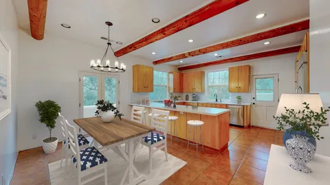 a kitchen with a refrigerator a sink and a stove