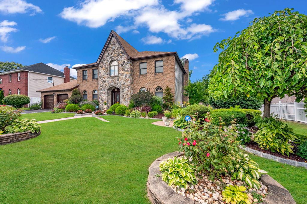 35 Poe Street Staten Island, NY 10307 - Photo 4 of 36 a front view of a house with a garden