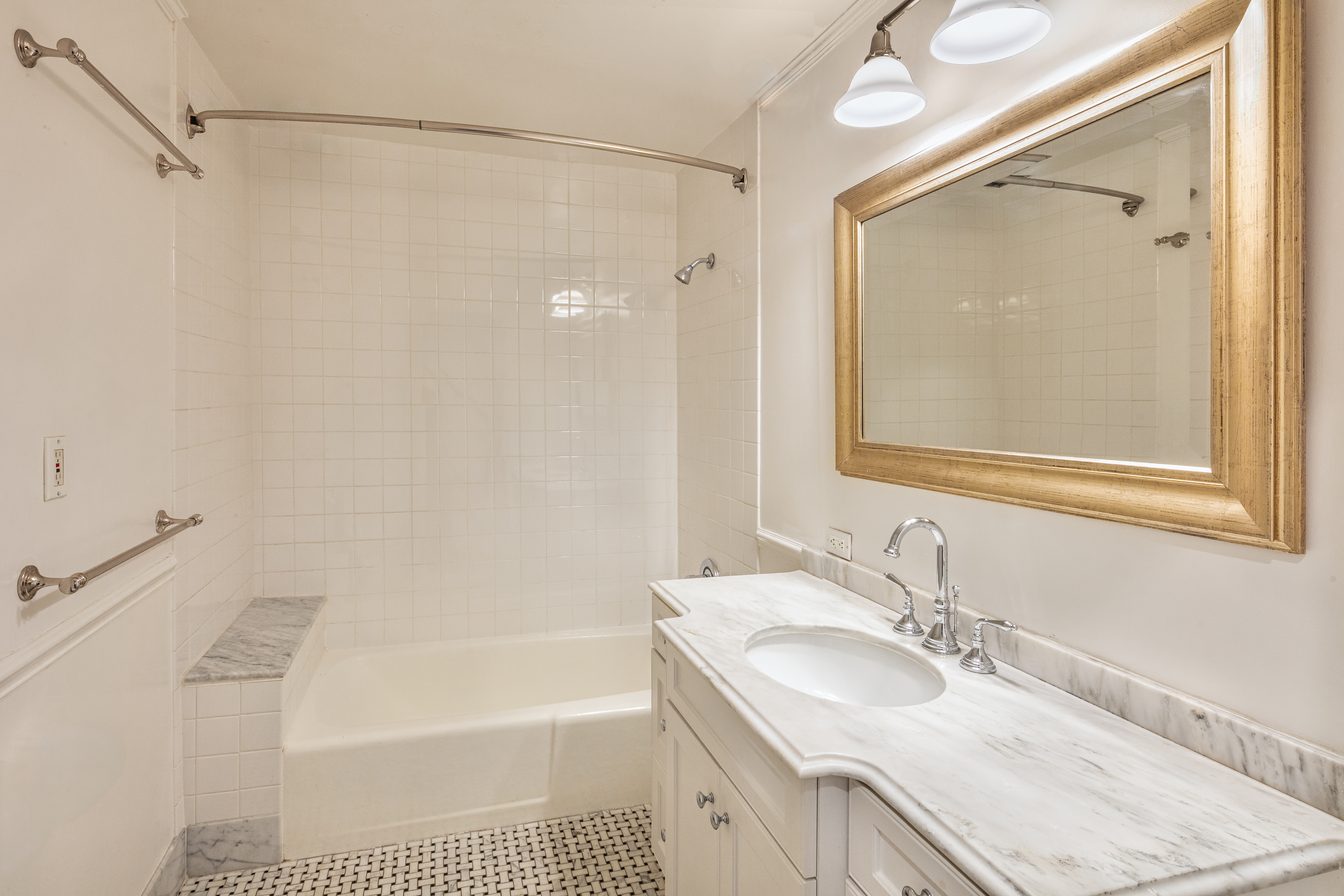 112 West 78th Street, Unit PARLOR Manhattan, NY 10024 - Photo 27 of 37 a bathroom with a sink vanity granite tub shower and a mirror