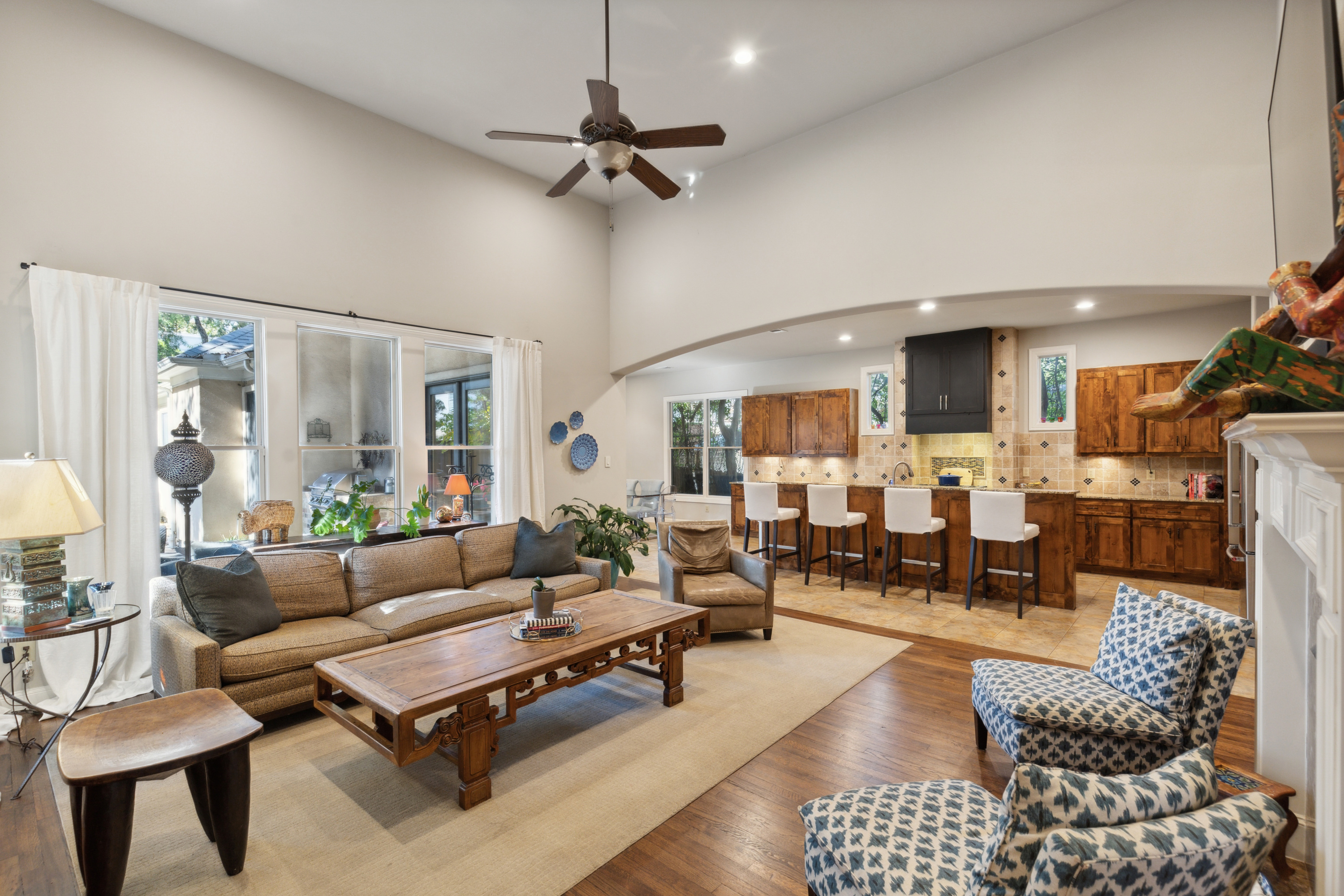 8411 Midway Road Dallas, TX 75209 - Photo 10 of 29 a living room with furniture kitchen view and a table
