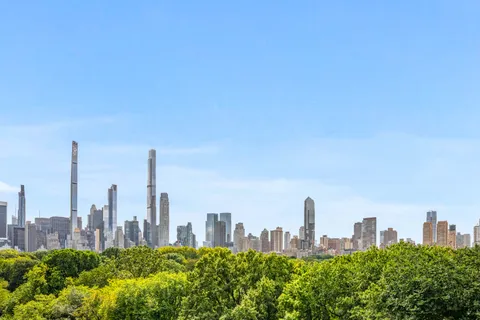 a living room with furniture a table and window