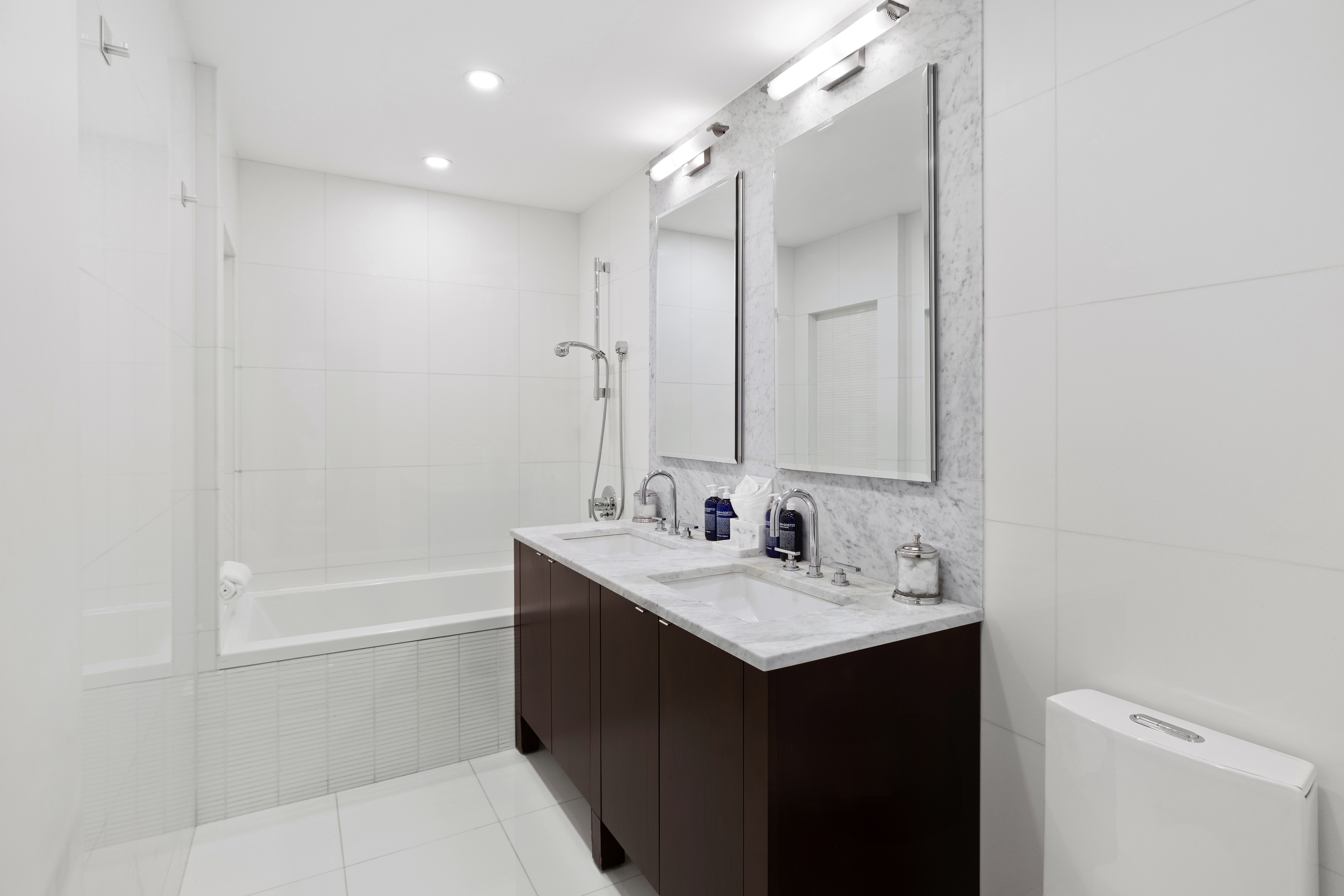 129 West 123rd Street, Unit 3 Manhattan, NY 10027 - Photo 11 of 20 a bathroom with a sink a toilet and shower