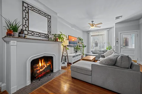 a dining room with furniture and wooden floor