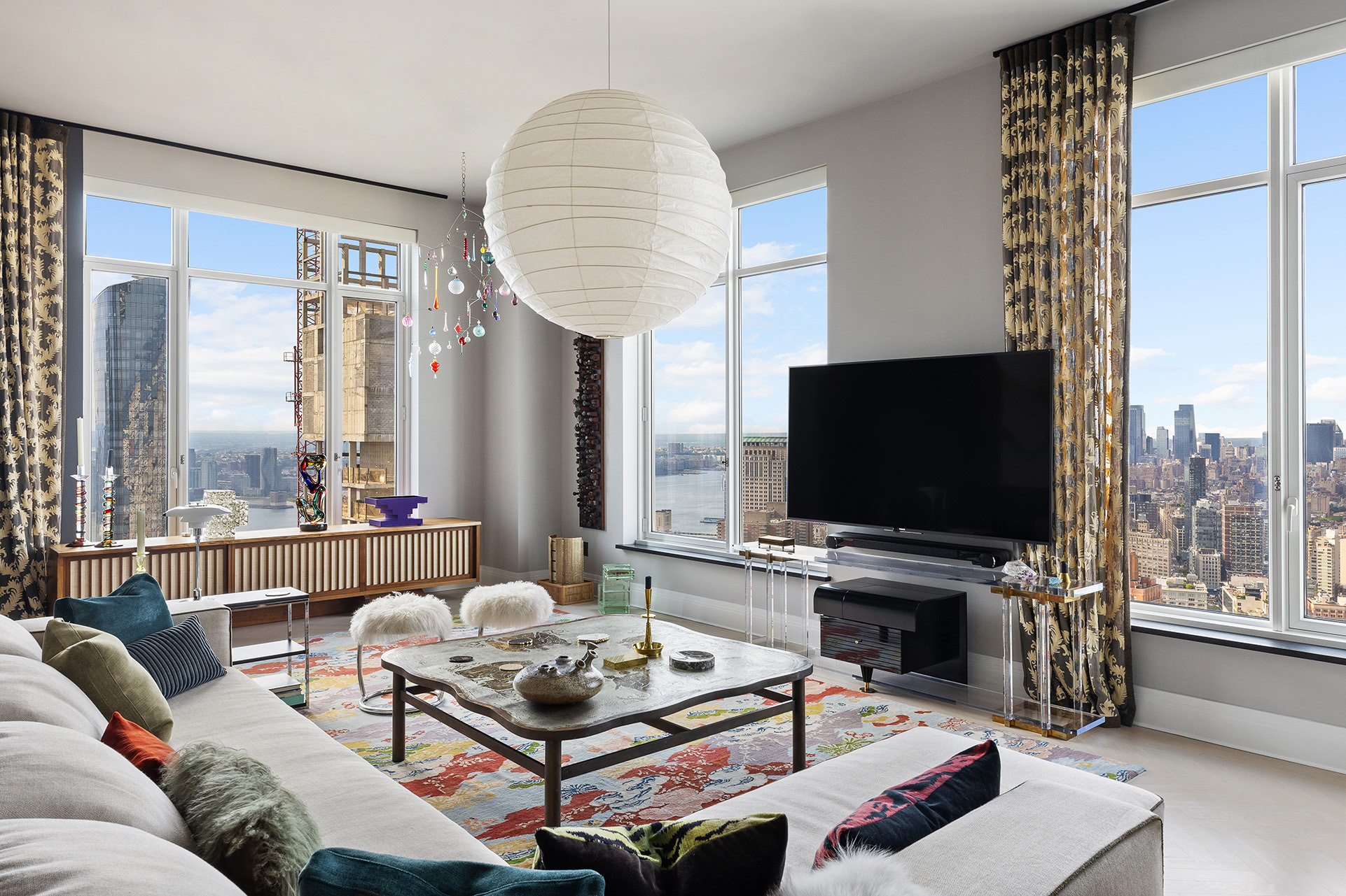 30 Park Place, Unit 59A Manhattan, NY 10007 - Photo 2 of 23 a living room with furniture a flat screen tv and a large window