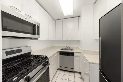 a kitchen with a stove and a microwave