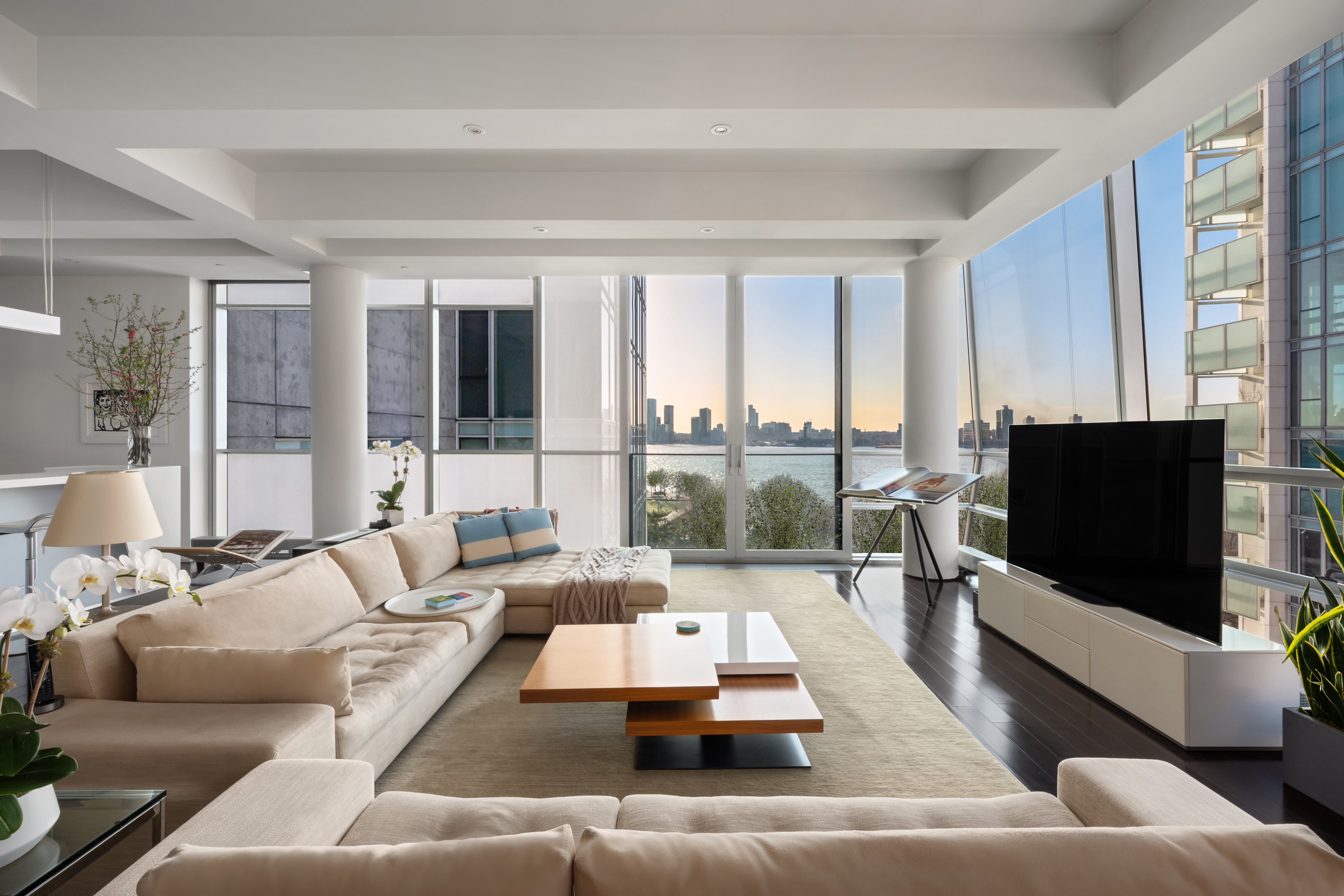 a living room with furniture and a flat screen tv