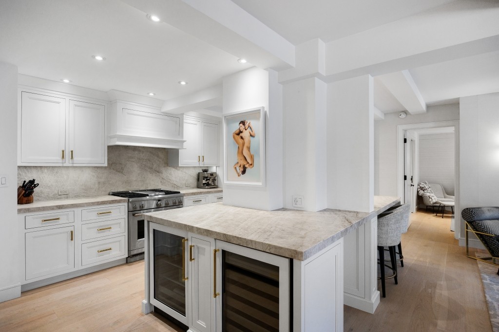 433 West 34th Street, Unit 4ABC Manhattan, NY 10001 - Photo 4 of 20 a kitchen with a stove and a sink