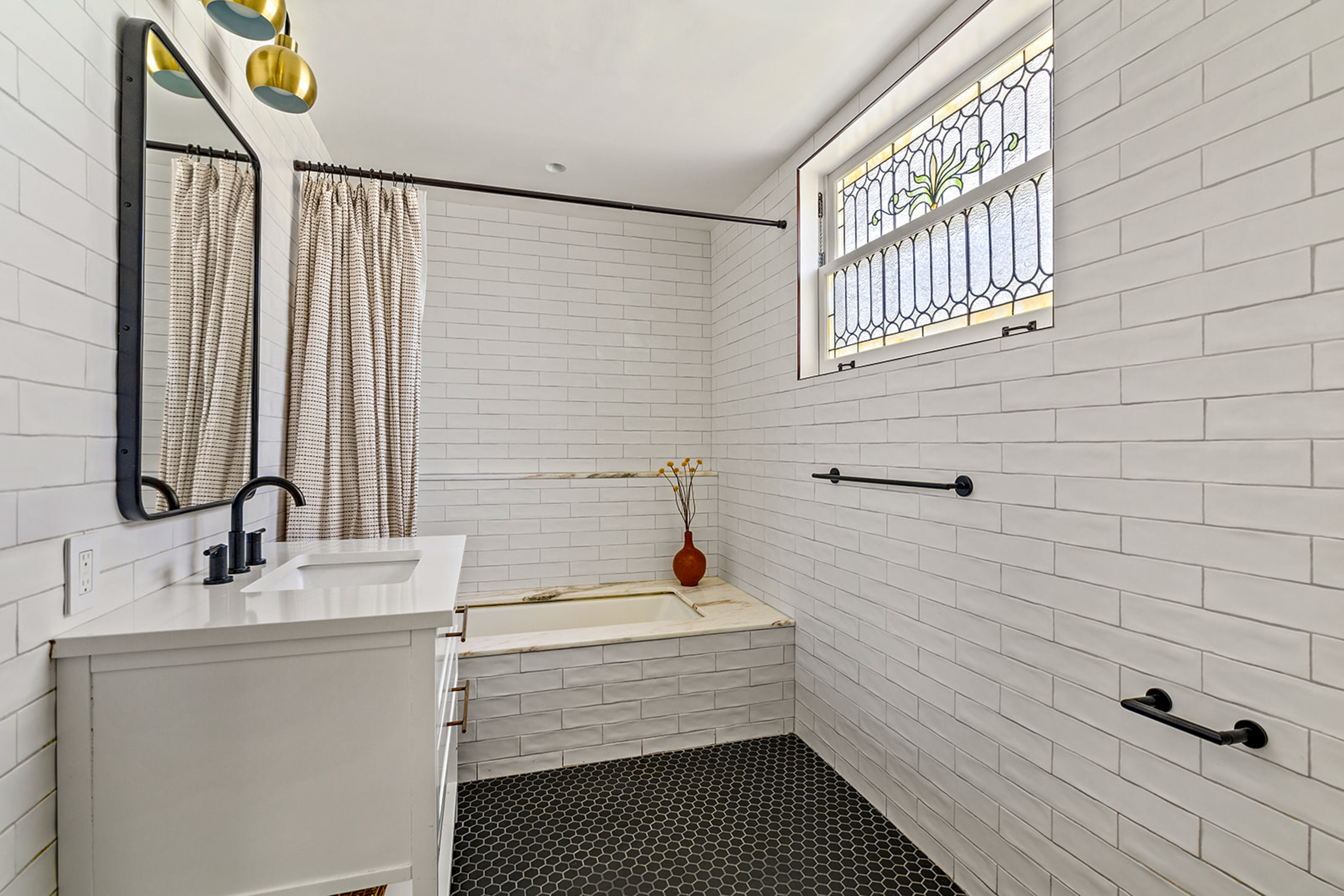 1221 Albemarle Road Brooklyn, NY 11218 - Photo 32 of 45 a bathroom with a bathtub and a sink