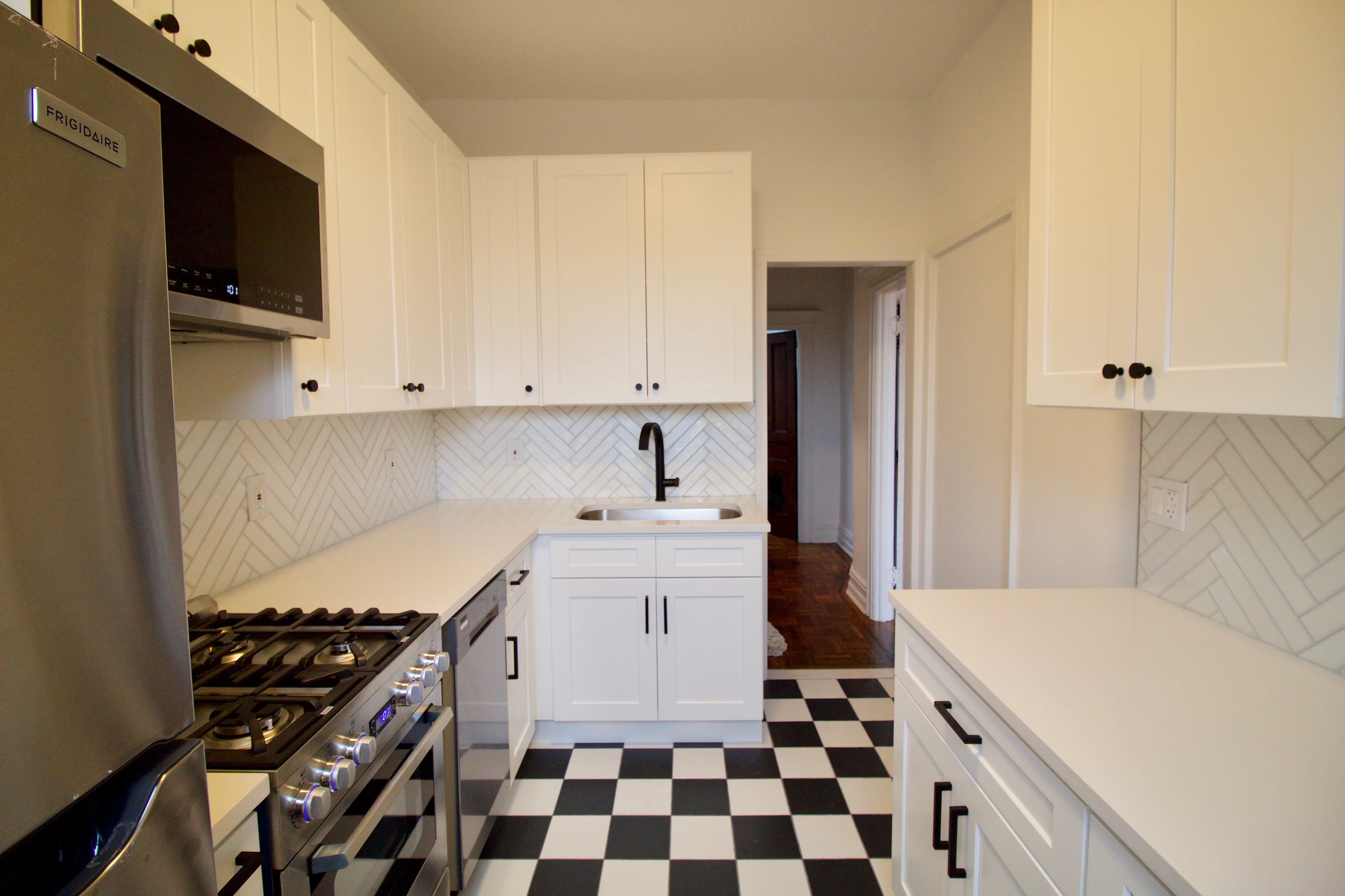 403 Caton Avenue, Unit 3 Brooklyn, NY 11218 - Photo 6 of 31 a kitchen with a sink a stove and a refrigerator