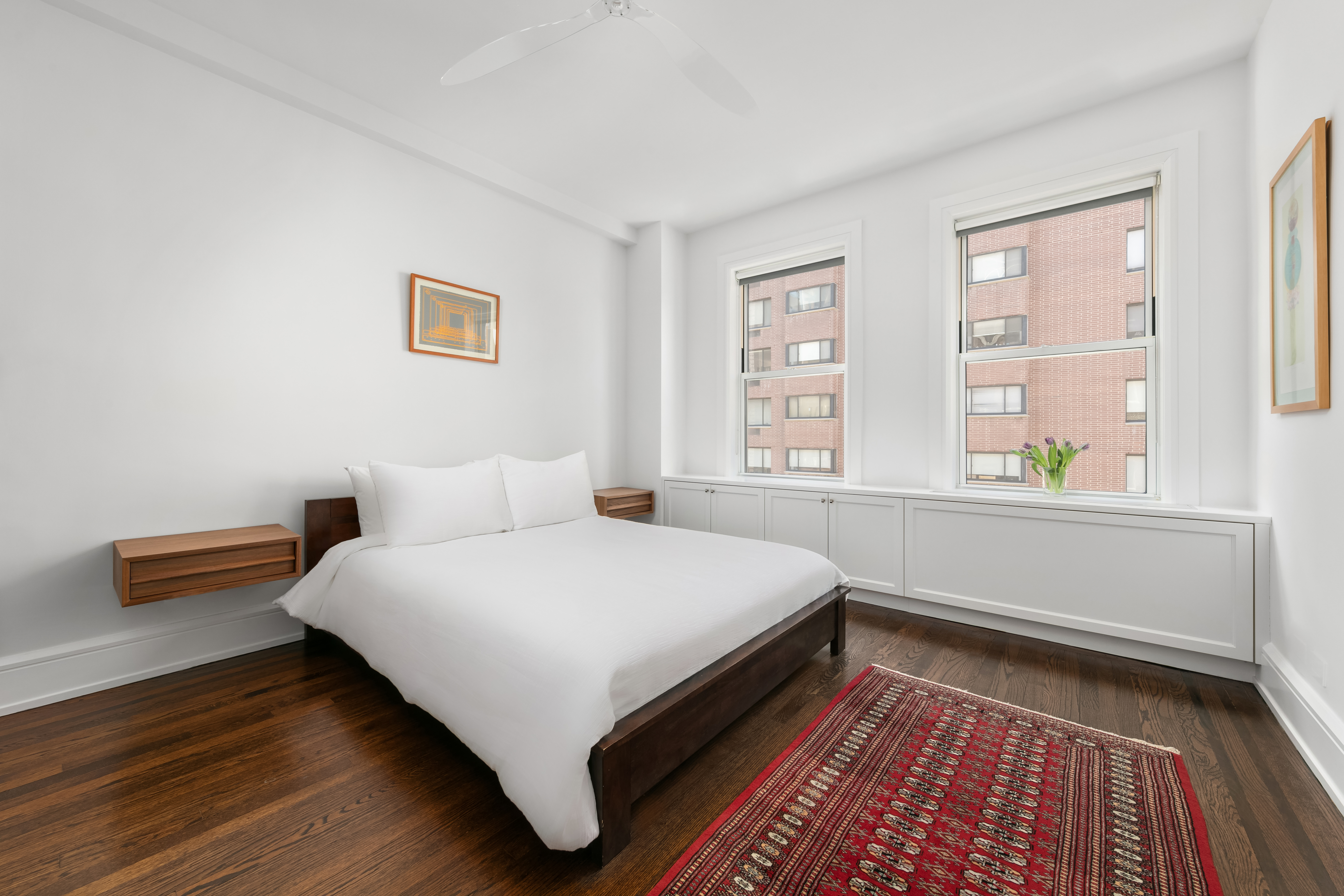 150 East 93rd Street, Unit 6AC Manhattan, NY 10128 - Photo 5 of 17 a bed room with a bed and a window