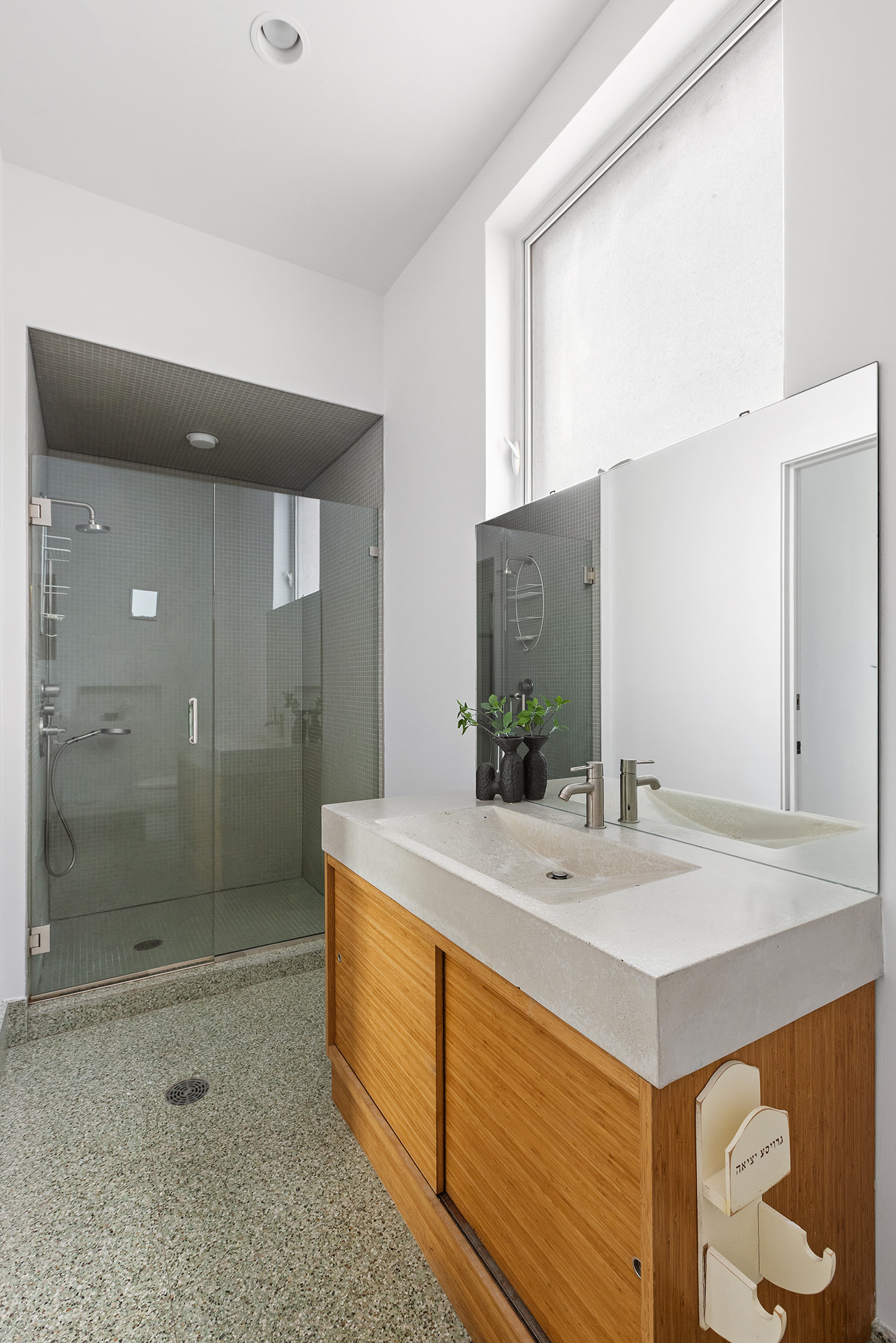 345 West 54th Street Manhattan, NY 10019 - Photo 10 of 22 a bathroom with a sink and a mirror