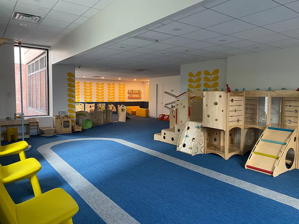 415 East 37th Street, Unit 32G Manhattan, NY 10016 - Photo 15 of 19 a living room with furniture and a flat screen tv