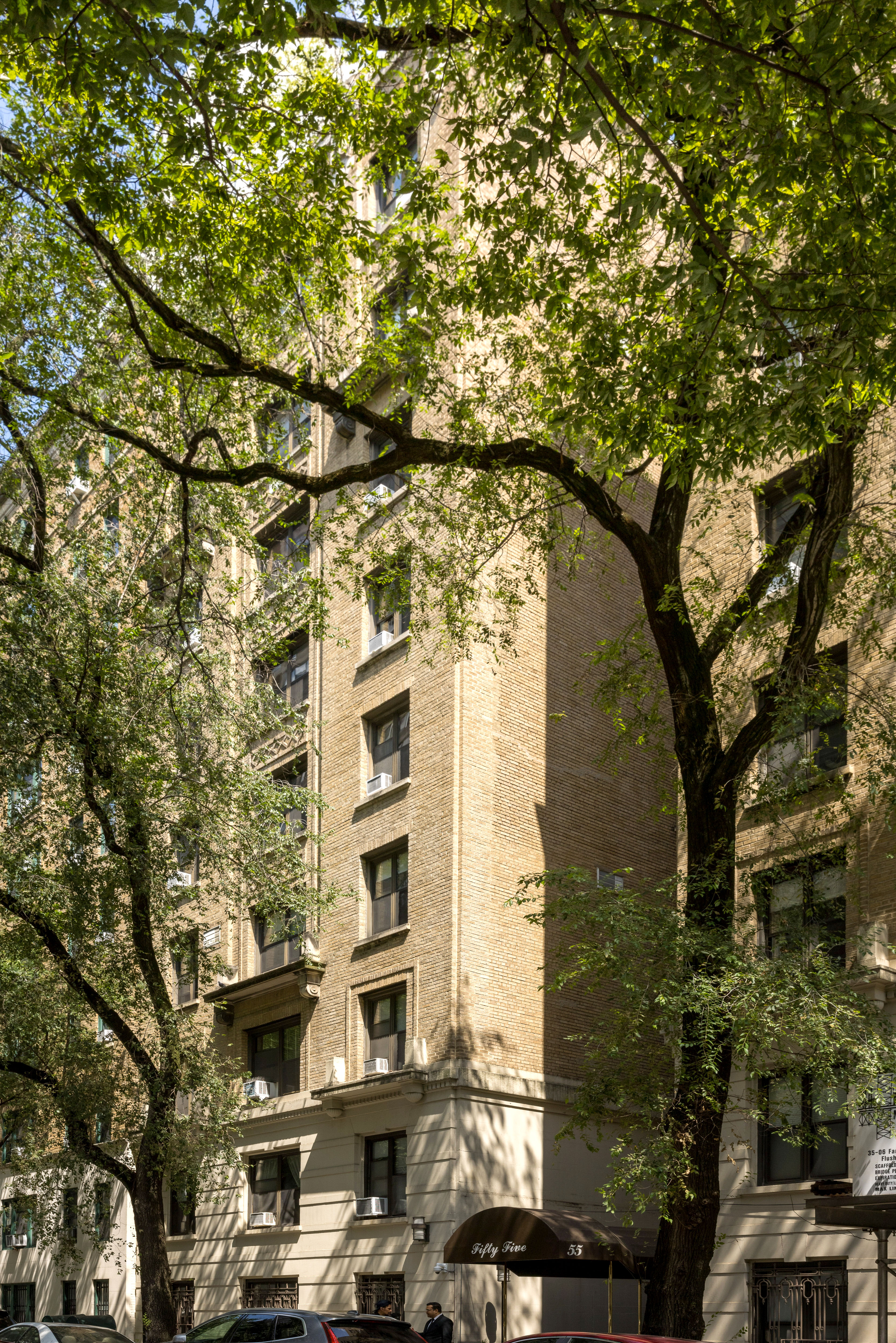 55 West 95th Street, Unit 51 Manhattan, NY 10025 - Photo 8 of 10 front view of a building with a tree