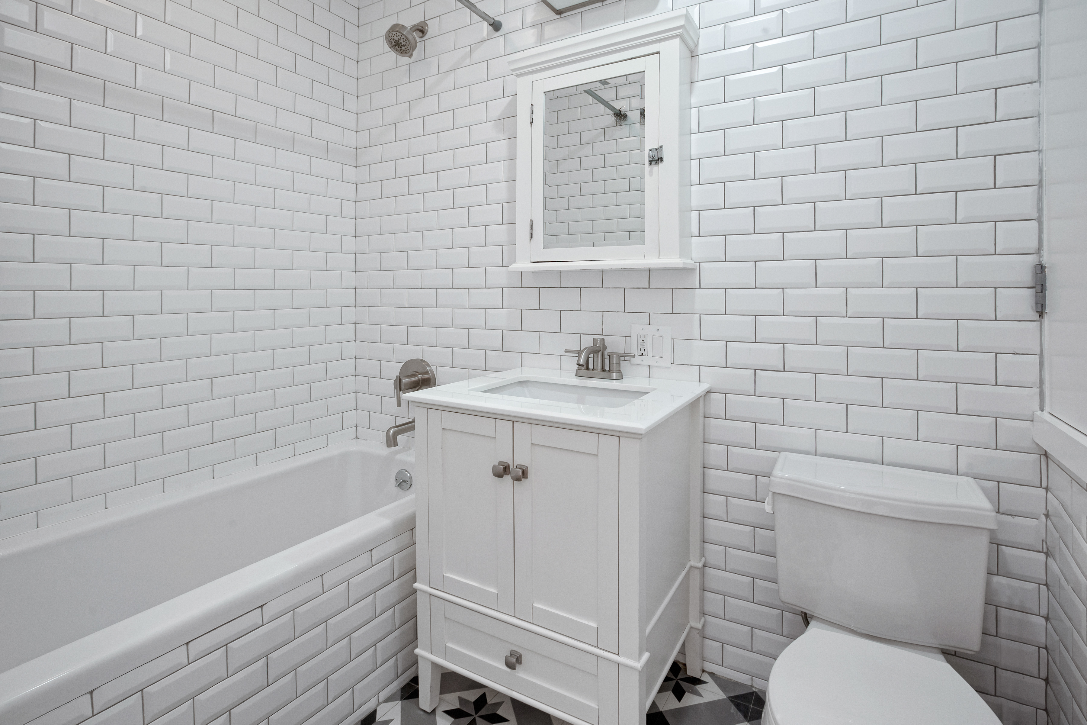 875 Saint Marks Avenue, Unit 1B Brooklyn, NY 11213 - Photo 6 of 9 a bathroom with a toilet a sink and bathtub