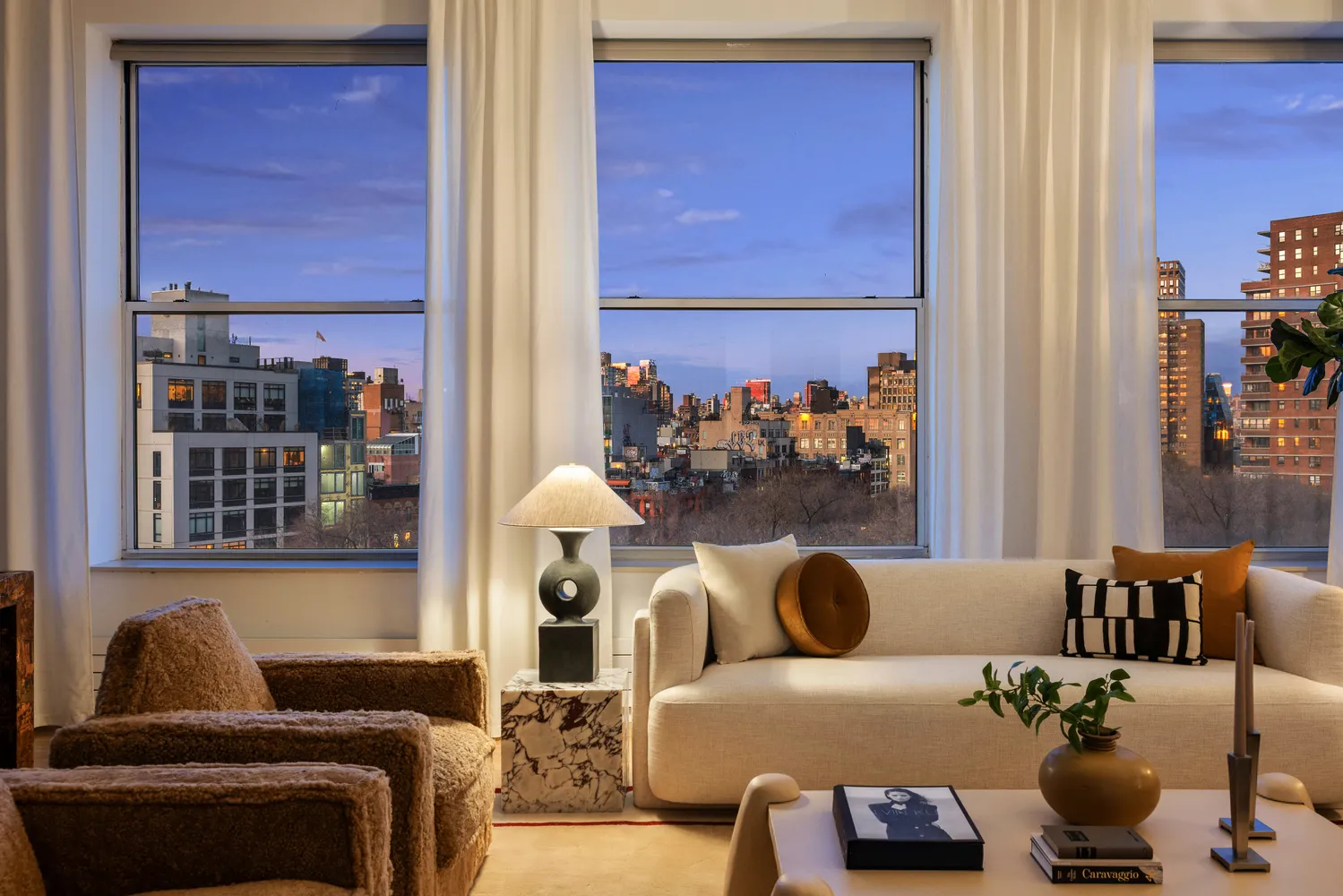 a living room with furniture and a window