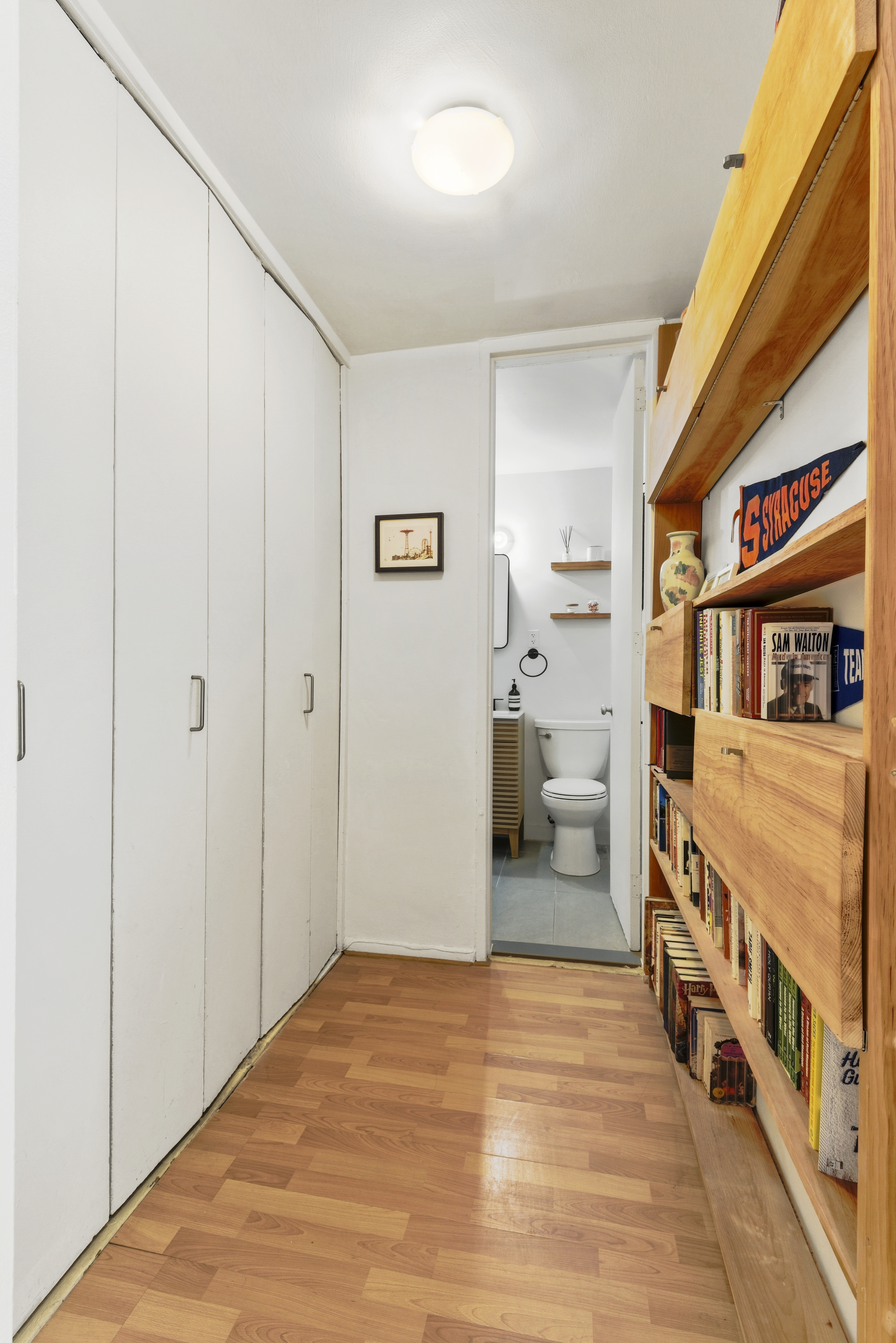 195 Willoughby Avenue, Unit 702 Brooklyn, NY 11205 - Photo 8 of 11 a bedroom with furniture and white walls