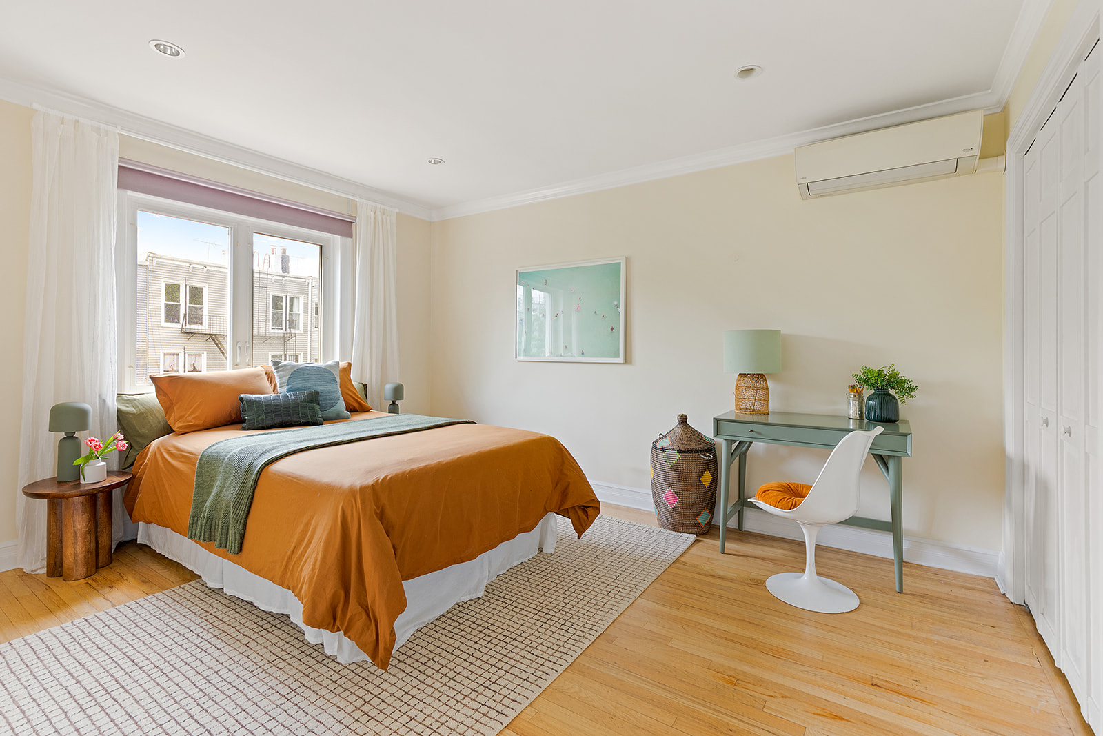 22 Sharon Street Brooklyn, NY 11211 - Photo 5 of 10 a bedroom with a bed and a table