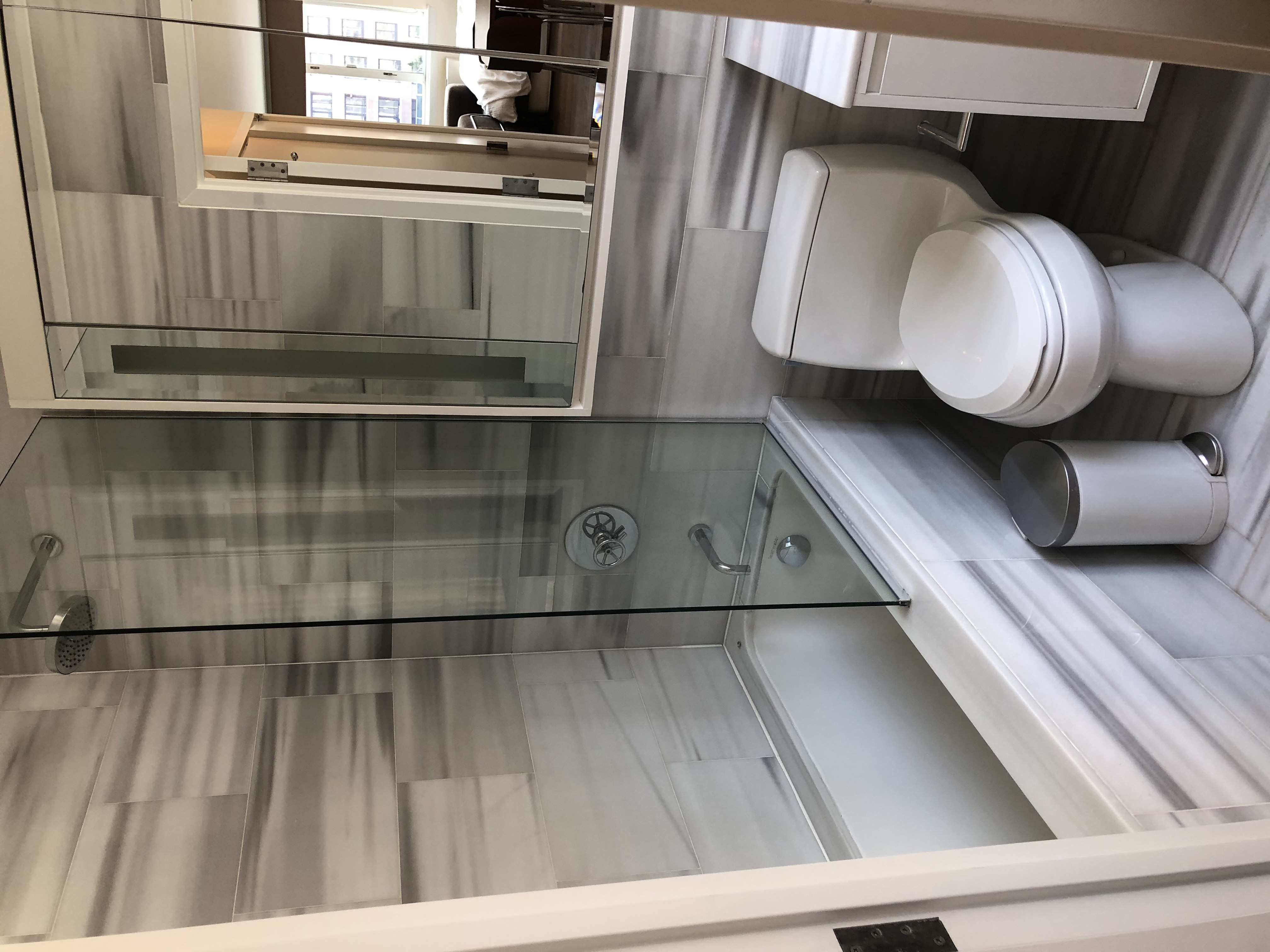 225 Rector Place, Unit 12F Manhattan, NY 10280 - Photo 5 of 7 a bathroom with a toilet and a shower